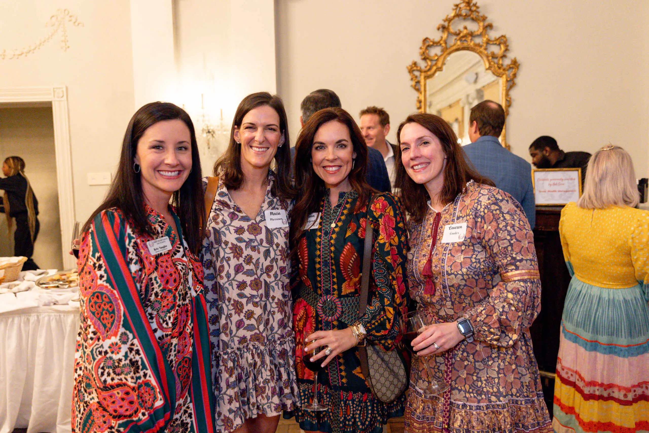 Group of four smiling for camera