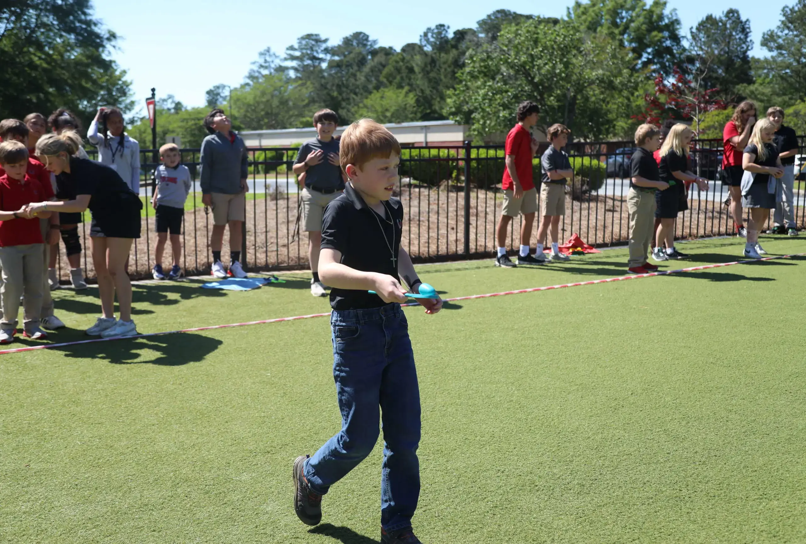 Aftercare students participating in Olympic Games-style sports day