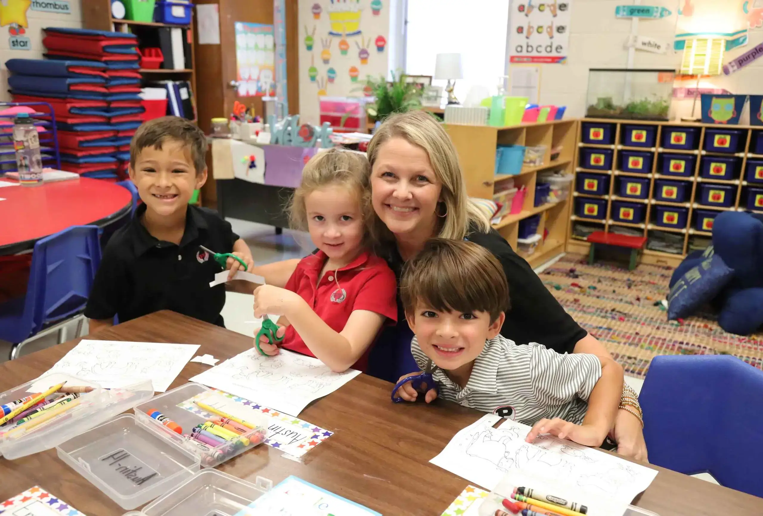 Kindergarten teacher with students.