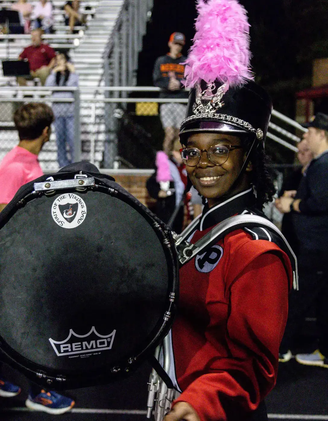 Band member get set to perform at a football game.