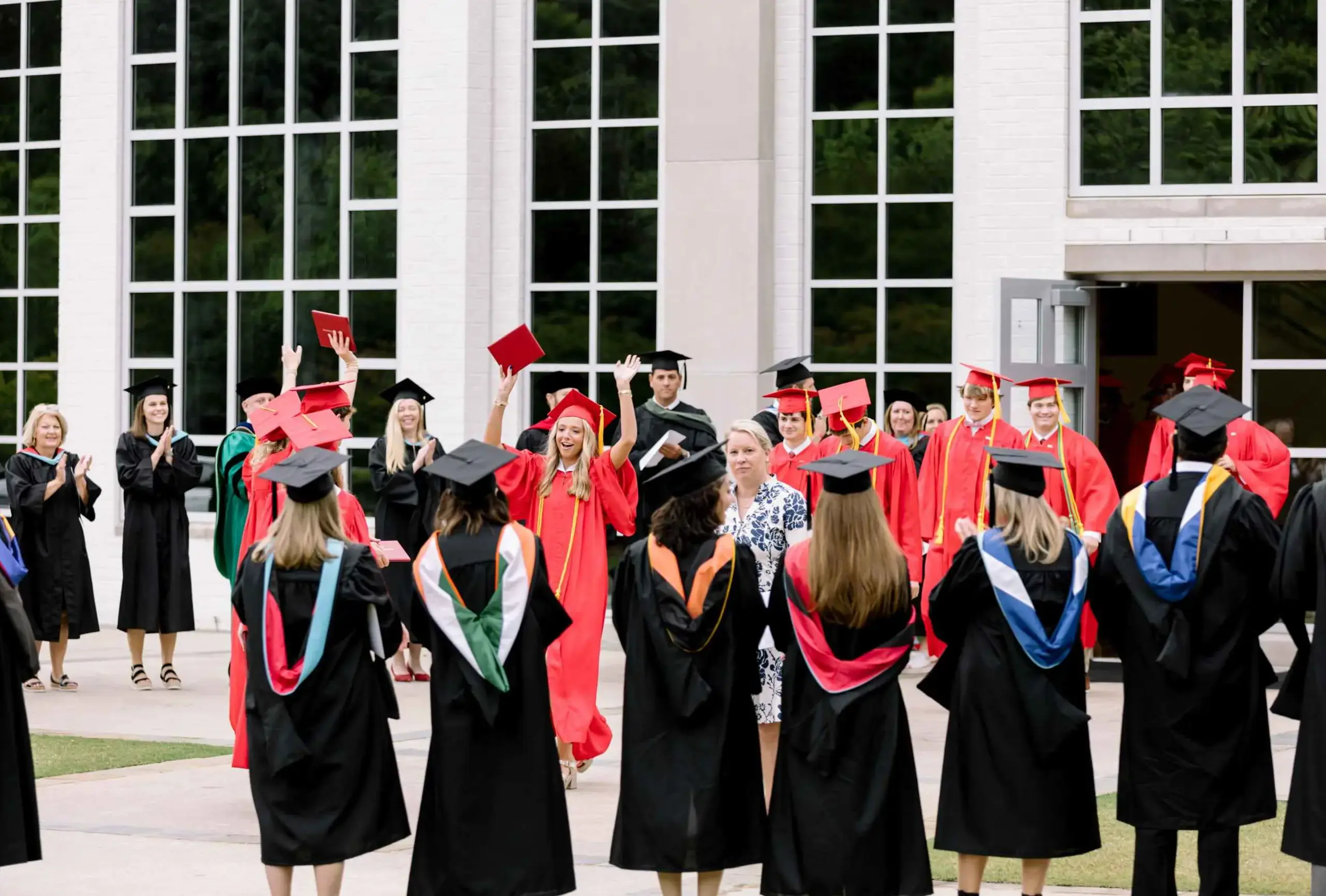 Graduate walks out of the church.