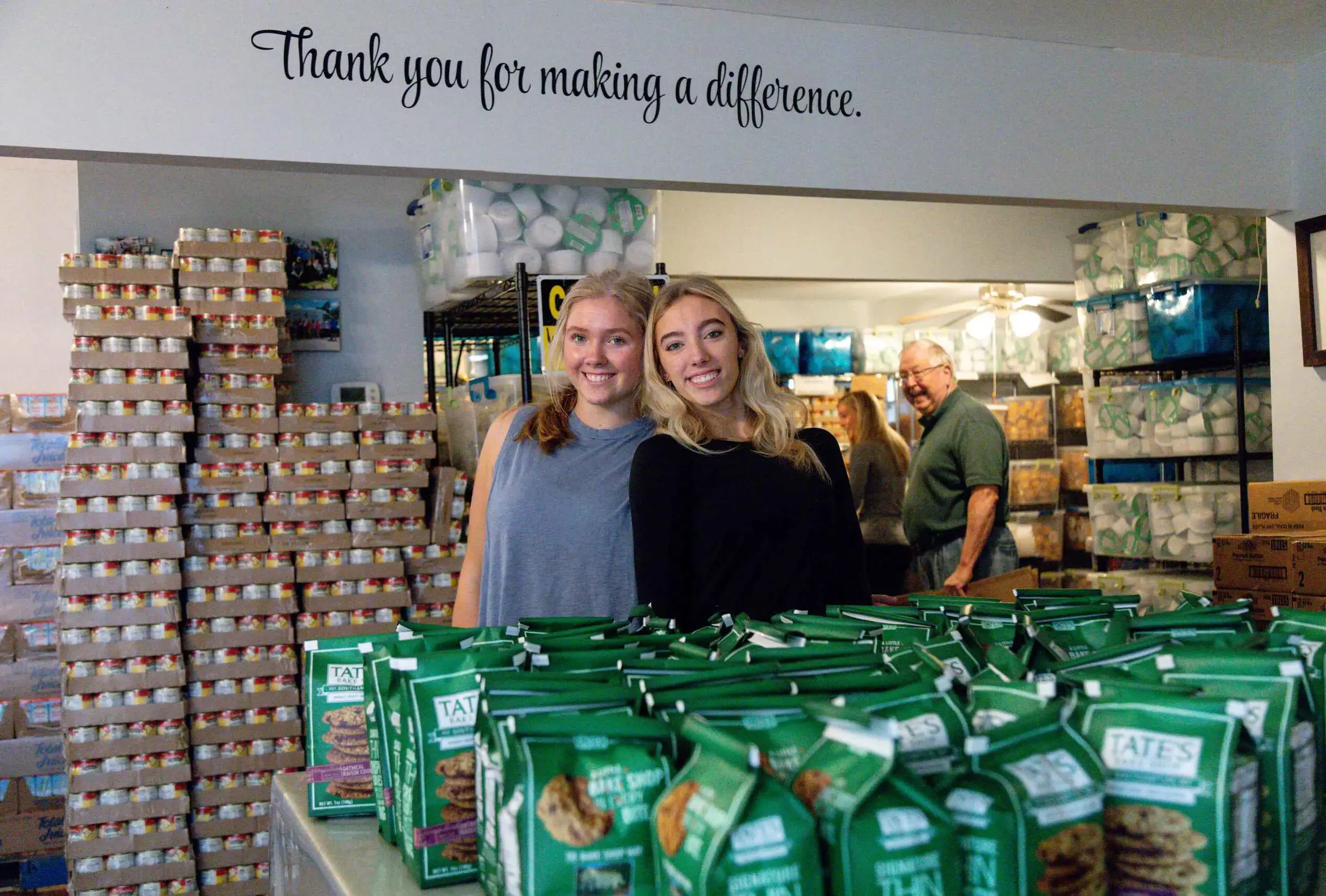 Students work in the food pantry for service day..