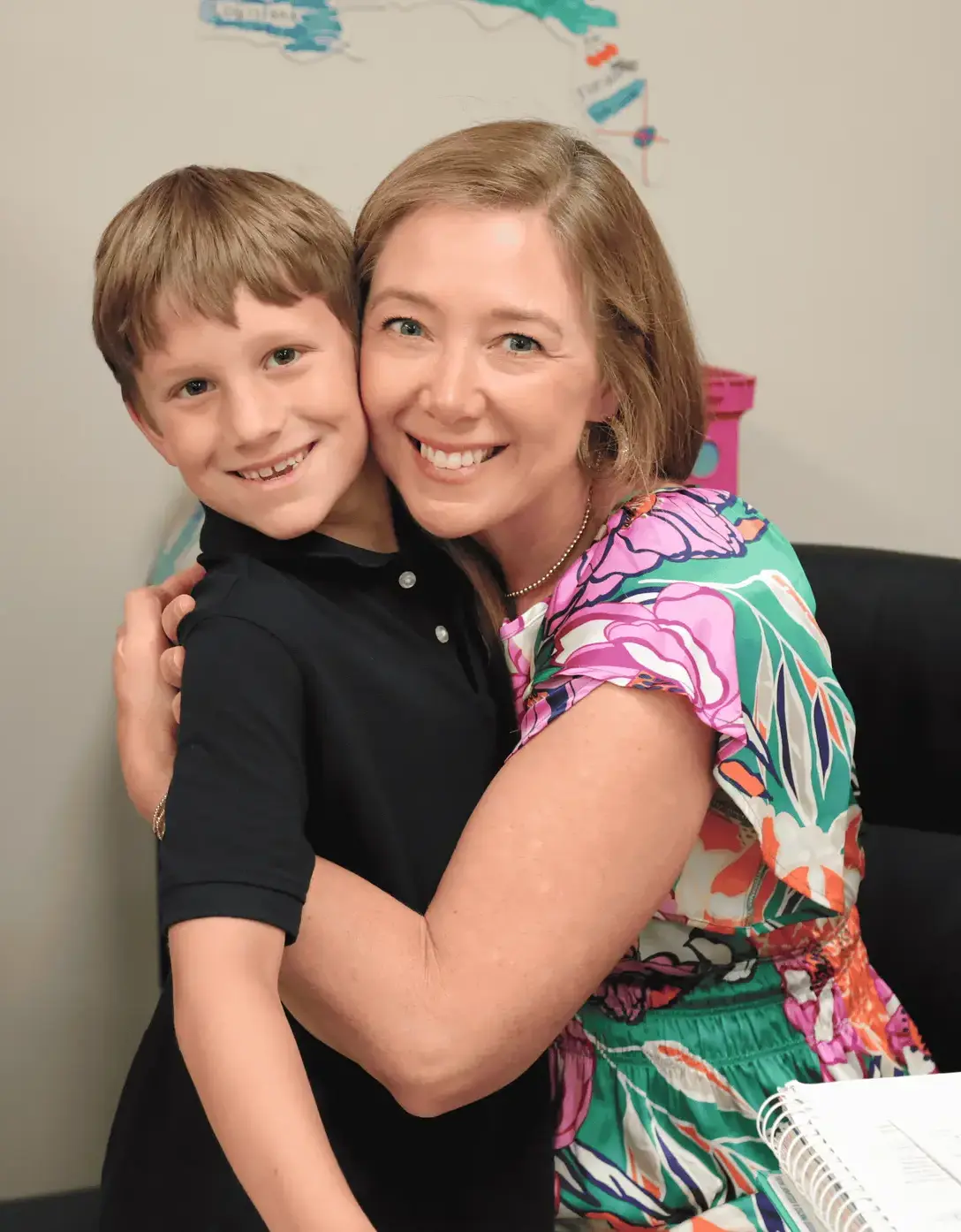 second-grade teacher with a student.